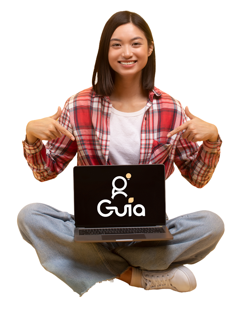 Student Sitting with Guia Logo on Laptop
